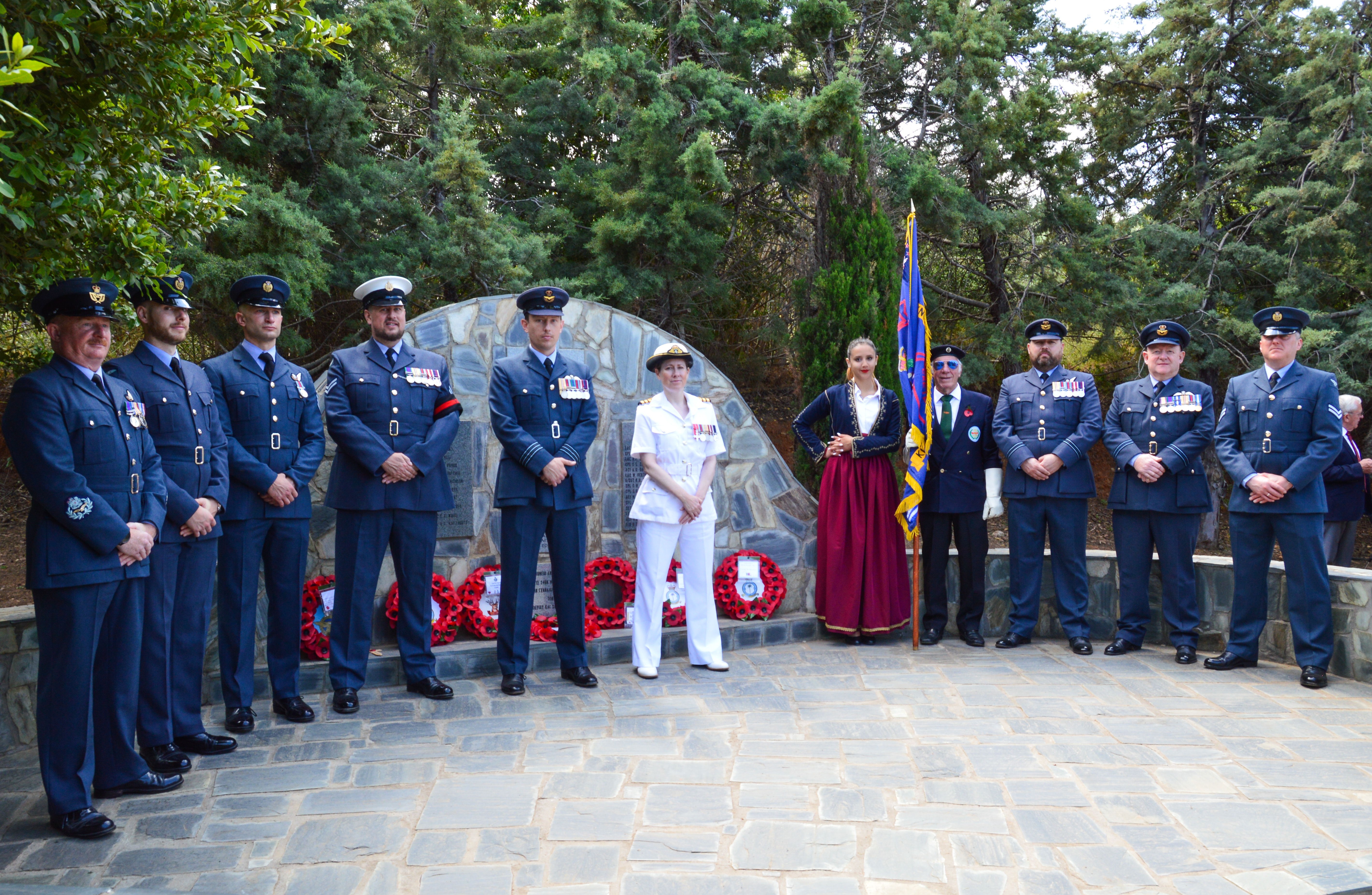 Personnel stand by memorial.